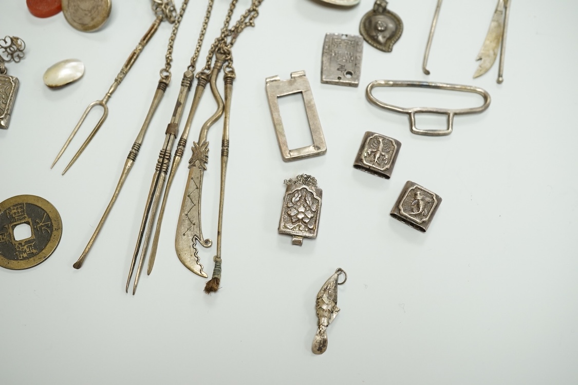 A collection of Chinese Straits white metal hooks, a chatelaine, South East Asian coinage and other items, etc.